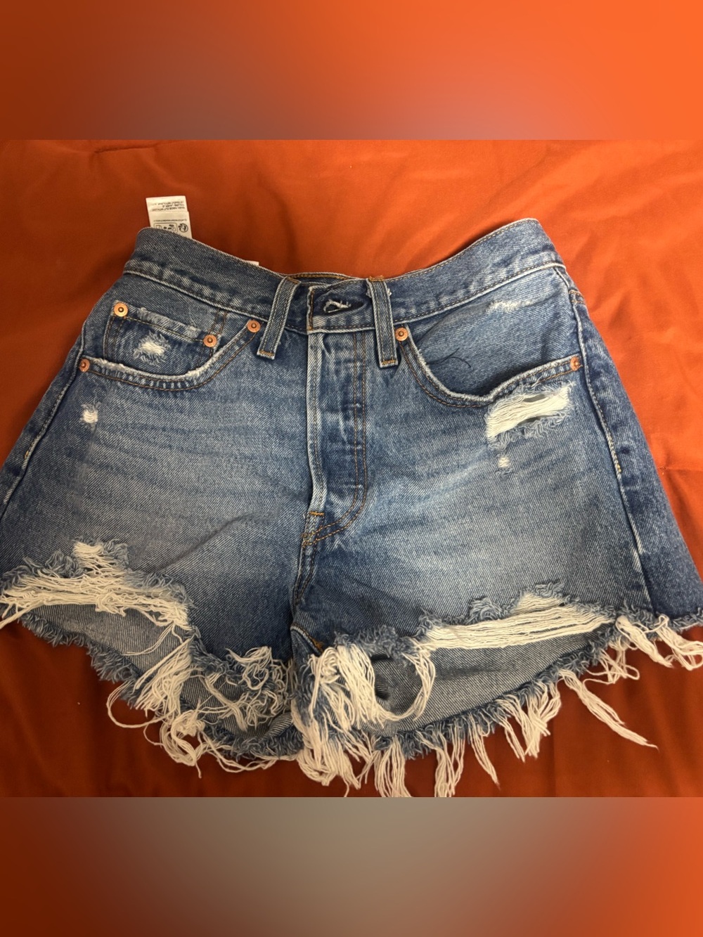 Levi's Medium Blue Denim Cutoff Shorts with Frayed Hem - Picture 2 of 5